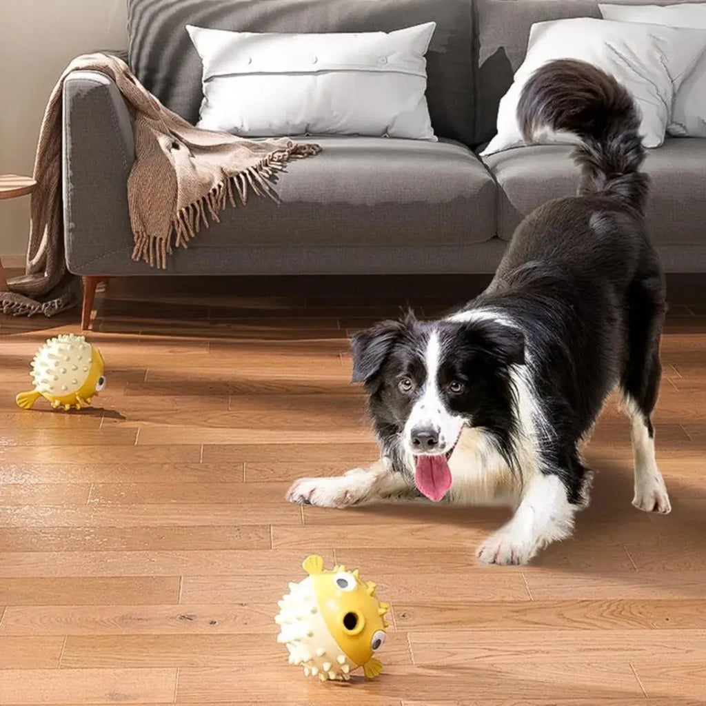 Yellow durable fish-shaped dog chew toy with textured surface for aggressive chewers.