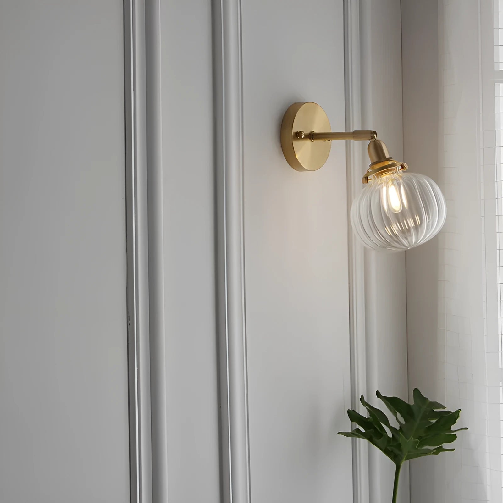 Pumpkin-shaped decorative glass wall lamp in water ripple, blue, or clear finish for living room or bedroom.