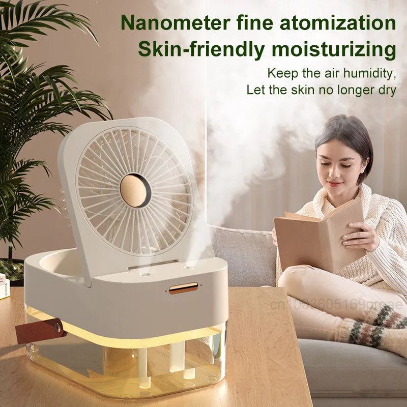 White desktop mist fan with humidifier tank and remote control on a wooden desk.