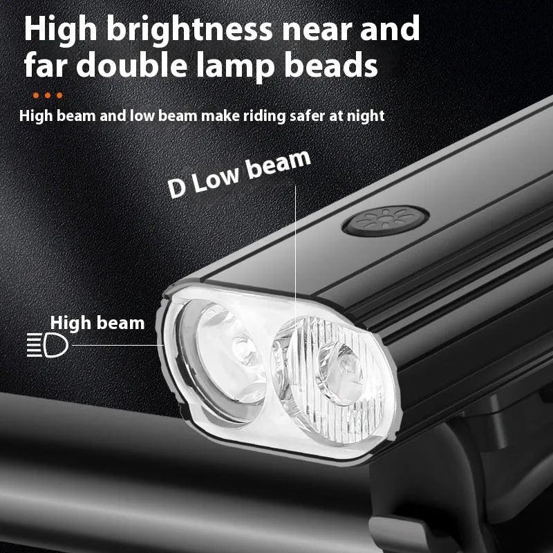 Aluminium alloy bicycle headlight with dual L2 lamps, USB Type-C charging port, and quick-release mounting base.