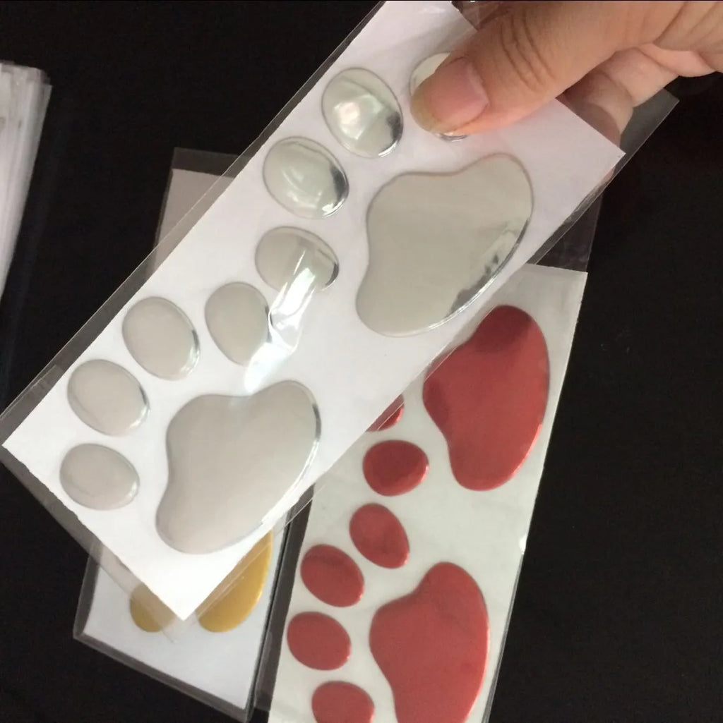 PVC car bumper sticker with footprints pattern and hand-shaped brush design measuring 7cm length