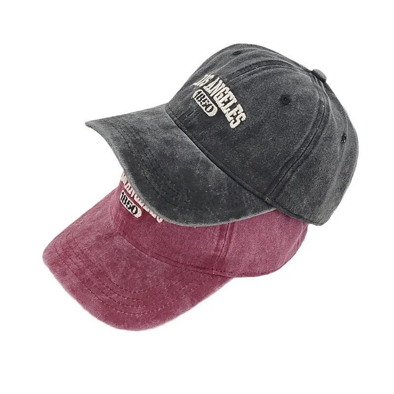 Retro personalised washed distressed embroidered peaked cap in beige with adjustable snapback.