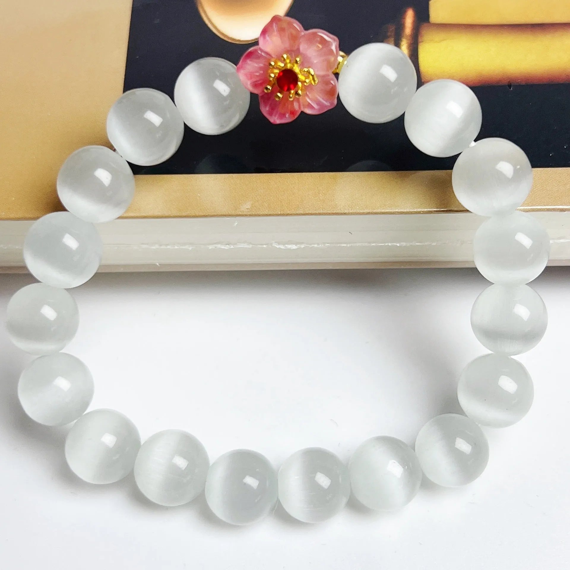 Handmade glass bead bracelet with flower design for women in yellow, pink, white, or green.