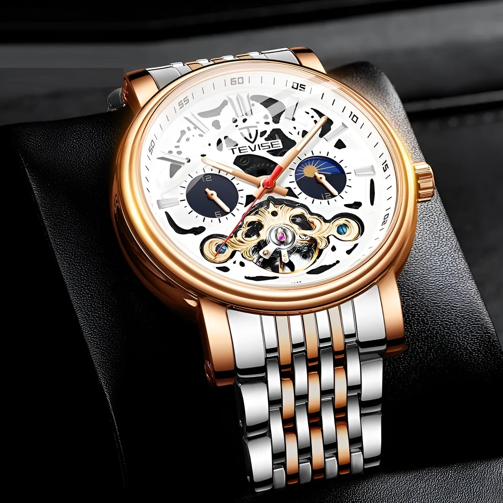 Men's black tourbillon mechanical watch with luminous hands on a leather strap.