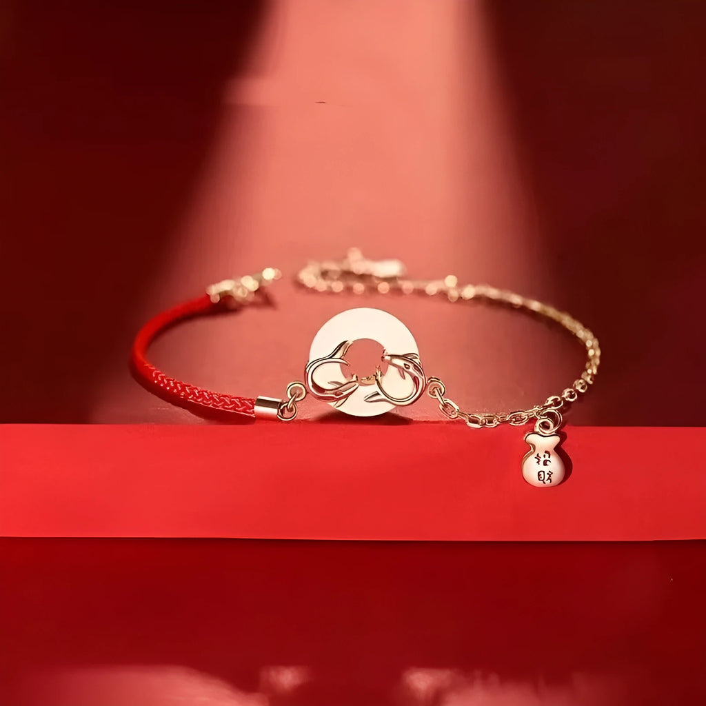 Festive koi bracelet with peace buckle charm on red rope, featuring fish tail decorative elements in Japanese style