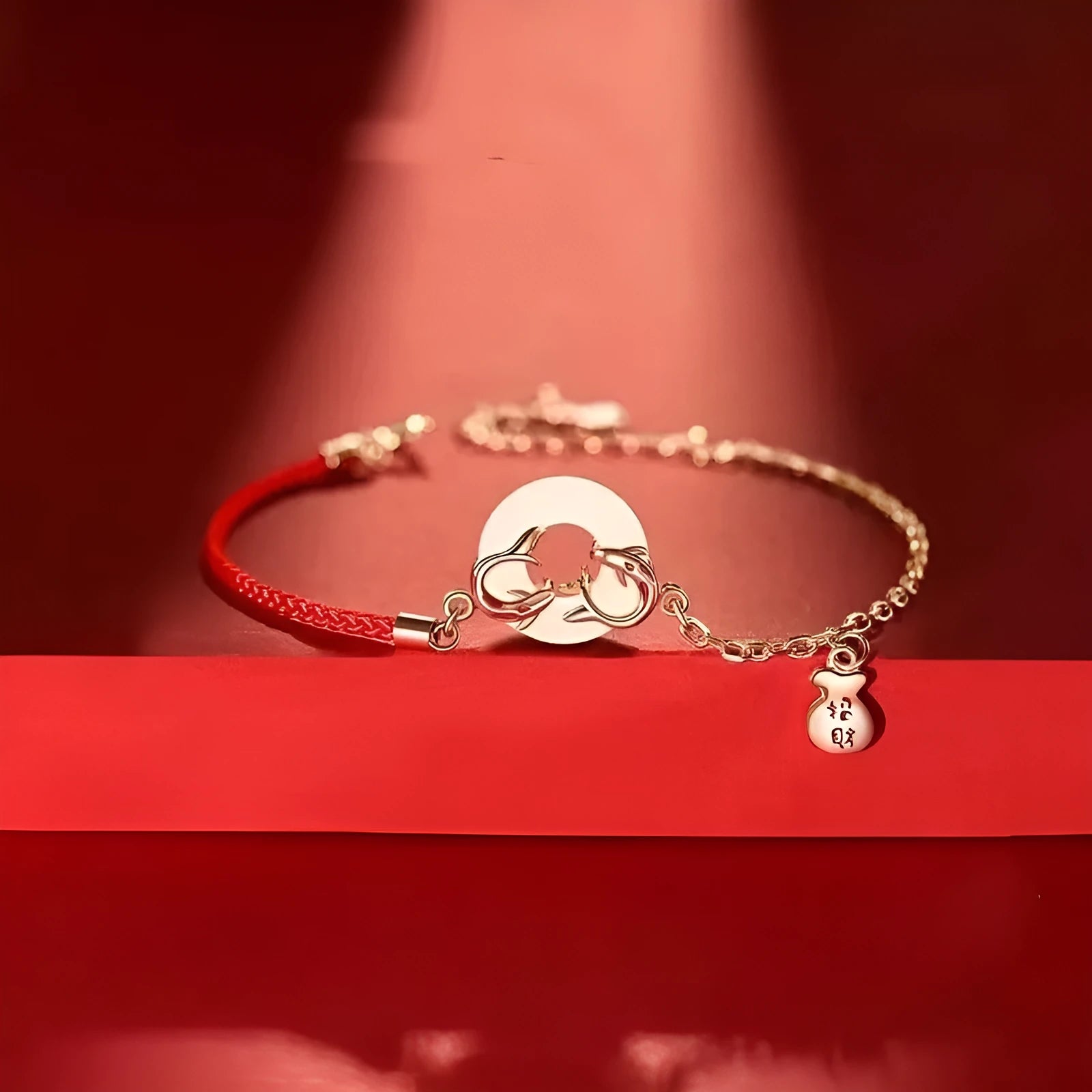 Festive koi bracelet with peace buckle charm on red rope, featuring fish tail decorative elements in Japanese style
