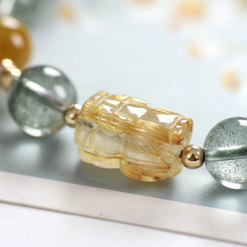 Green phantom quartz crystal bracelet with 8mm geometric beads and gold rutile inclusions