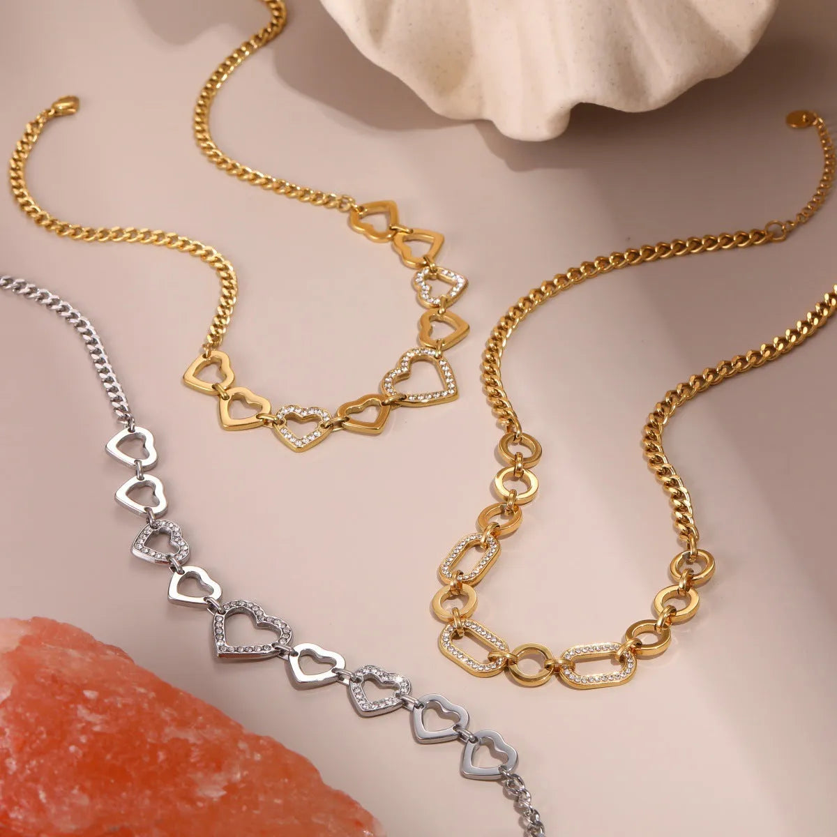 Geometric heart-shaped stainless steel necklace with 18K gold electroplated finish on clavicle chain