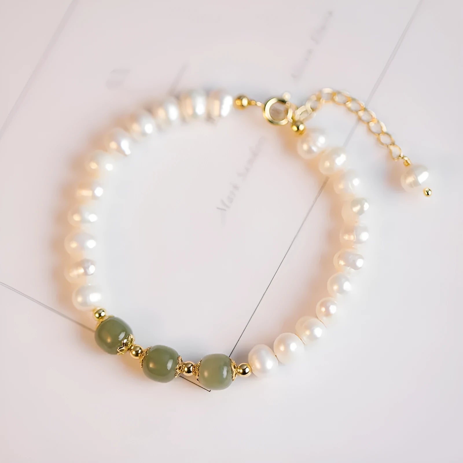 Korean style freshwater pearl bracelet with a diamond-shaped pearl in an electroplated Hetian jade colour.