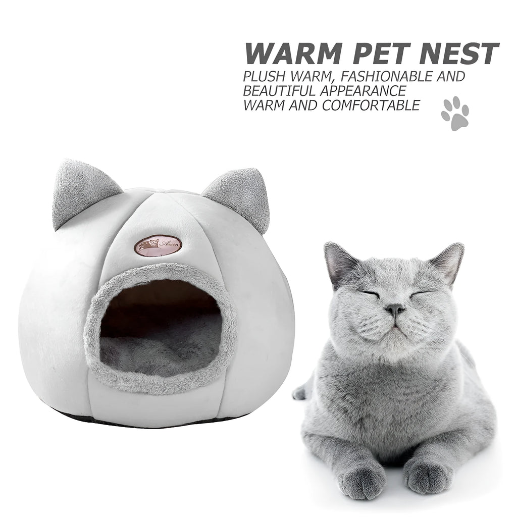 A fully enclosed cube-shaped cat sofa nest, showing the entrance hole, in a home setting.