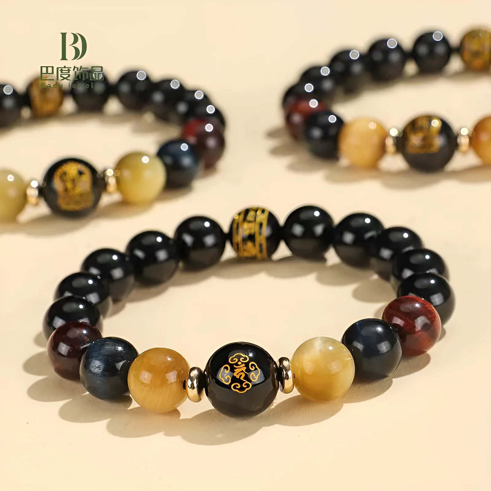 Manually crafted black agate beaded bracelet with gold, blue, and red tiger eye stones, showing ethnic zodiac design.