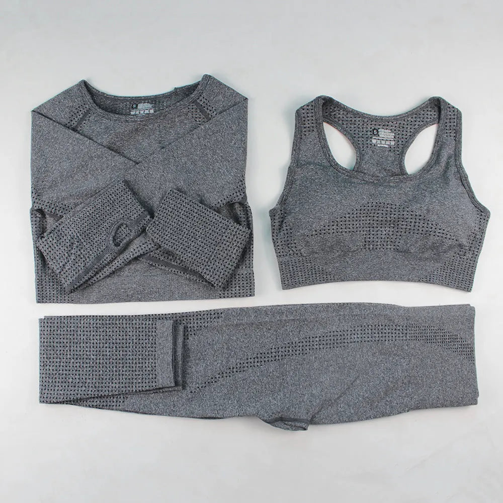 Three-piece yoga clothes set with bra, long sleeve top, and trousers in tight fit nylon blend fabric