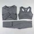 Three-piece yoga clothes set with bra, long sleeve top, and trousers in tight fit nylon blend fabric