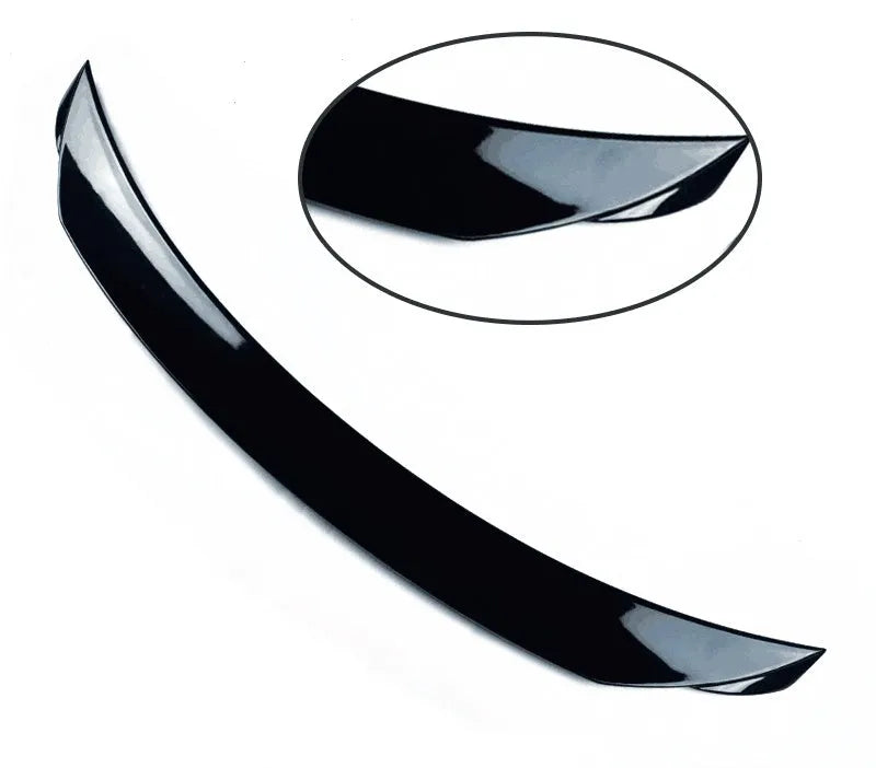 Bright black modified tail trim for Mazda 3 Exela 2014-2021 models showing large fixed wind surround design