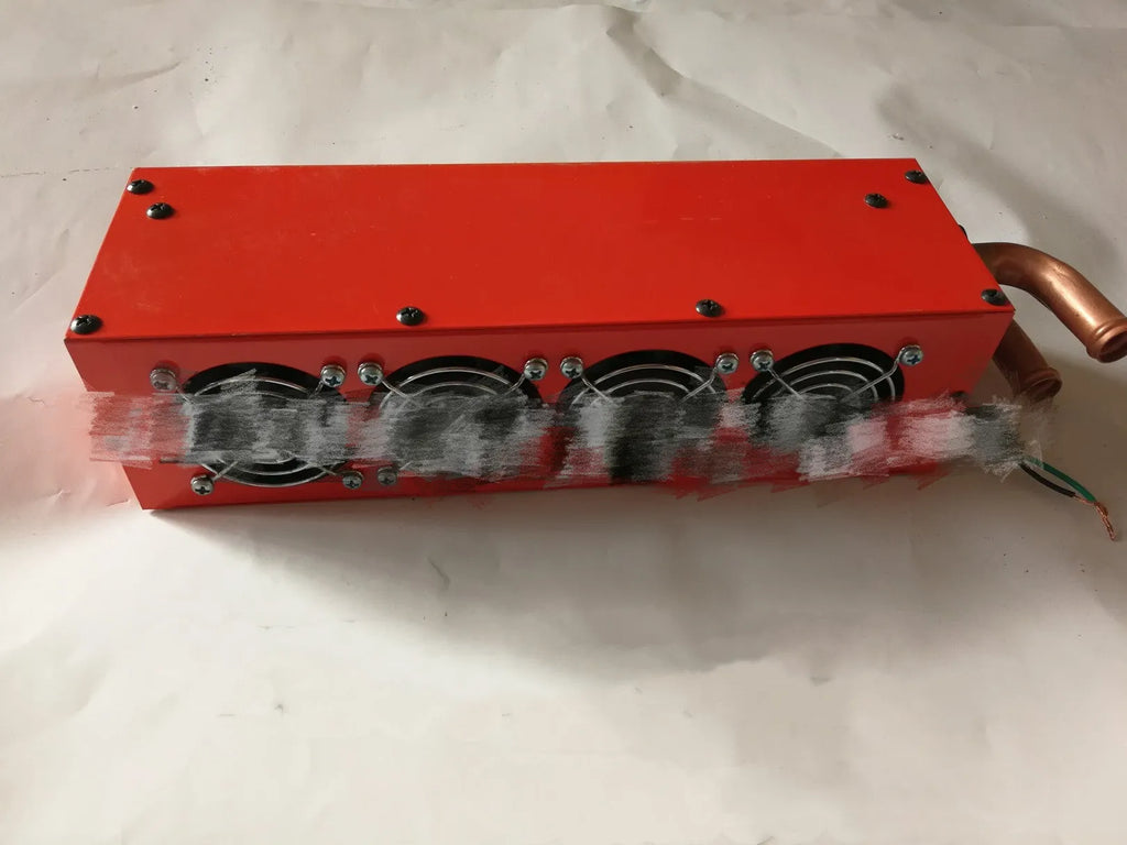 Metal car heater unit with copper pipe connections for 12V 24V auxiliary vehicle heating.