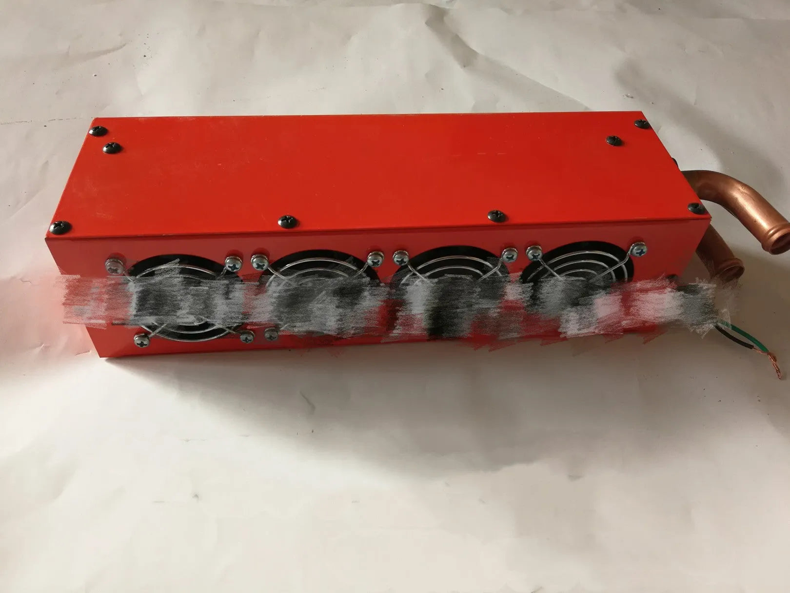 Metal car heater unit with copper pipe connections for 12V 24V auxiliary vehicle heating.