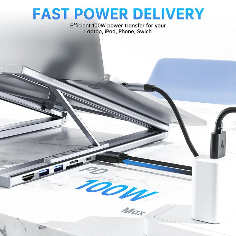 Aluminium folding laptop stand with 8-in-1 docking station hub showing connectivity ports