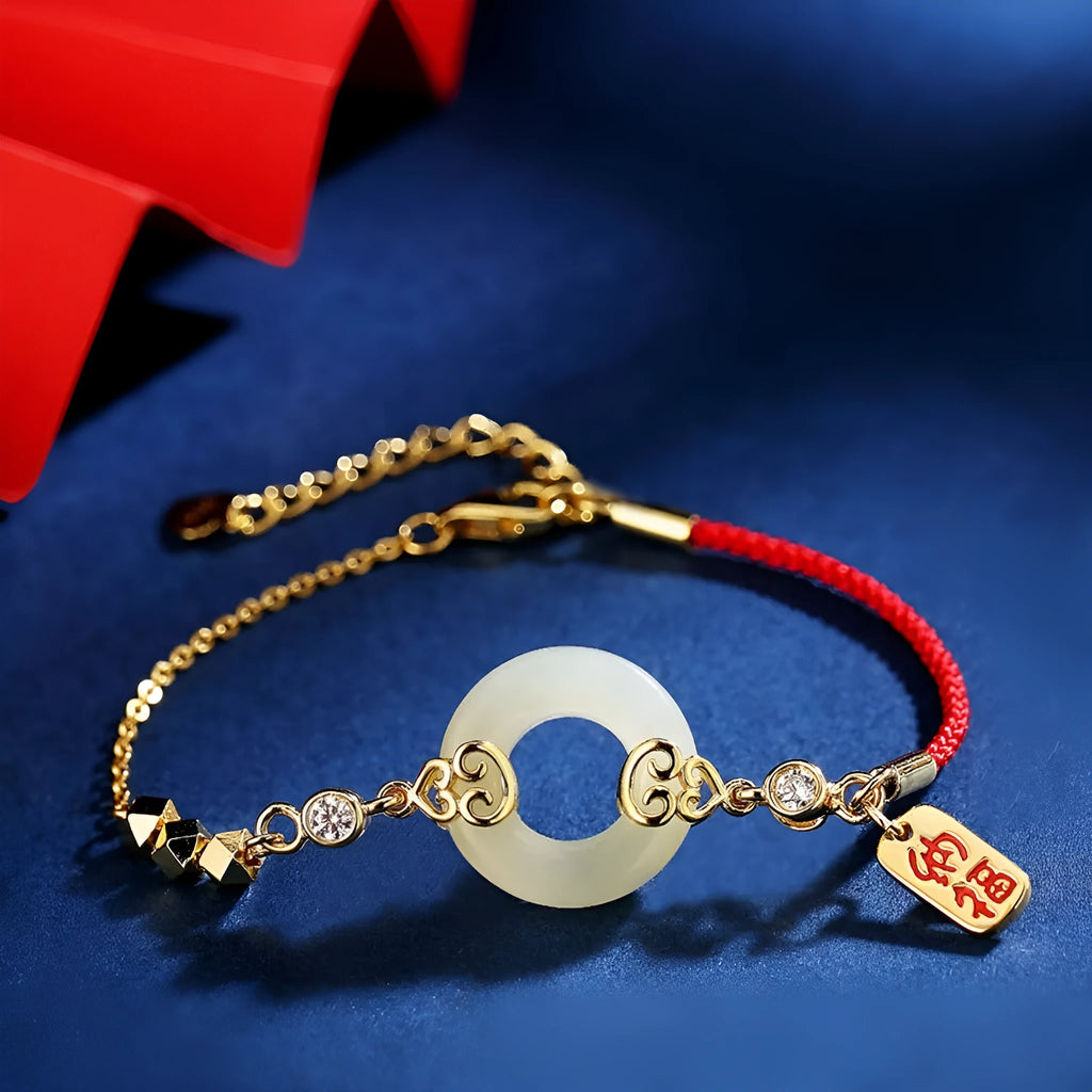 Chinese style sterling silver jewellery set showing gourd bracelet, Fu character necklace, and earrings with Hetian jade inlay.