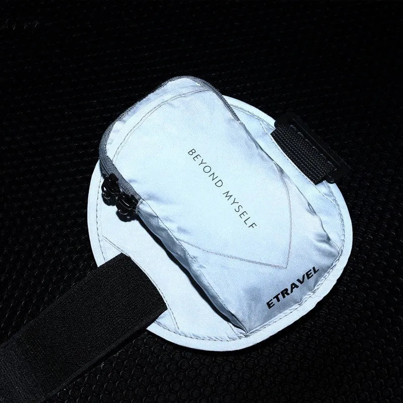 Black reflective running arm band with adjustable strap for a smartphone.