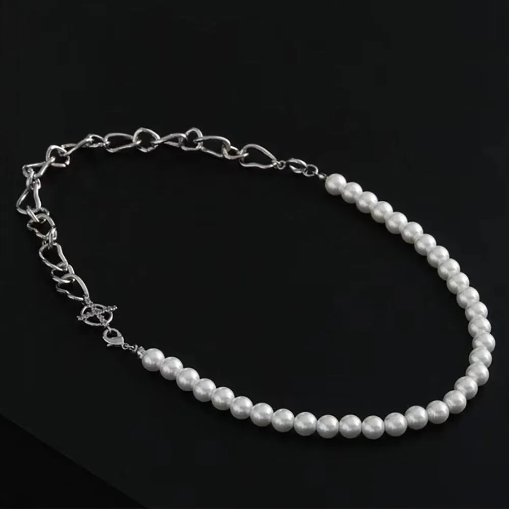 White asymmetric geometric acrylic pendant on a twisted chain necklace.