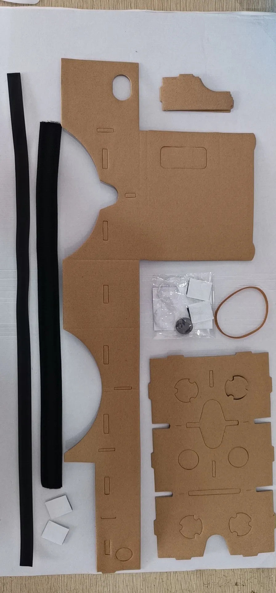 VR cardboard glasses for smartphones with rubber head strap in pink and white colours