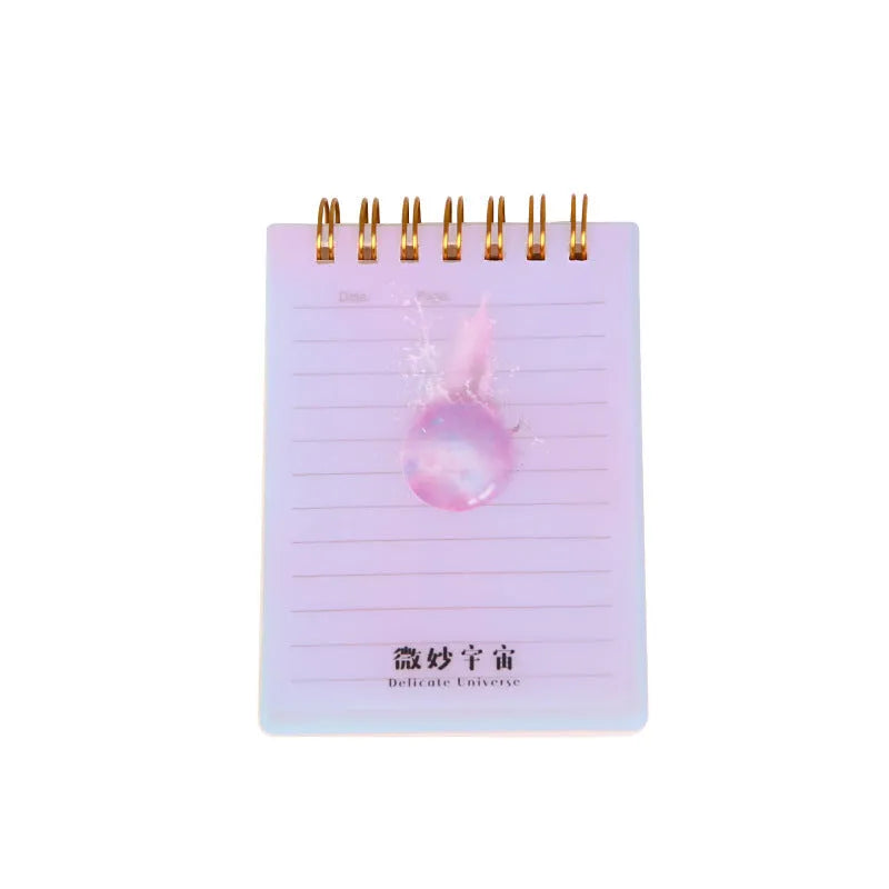 A7 spiral-bound pocket notebook with PP cover, shown in one of four colour series, open to show 80g paper and spiral binding.