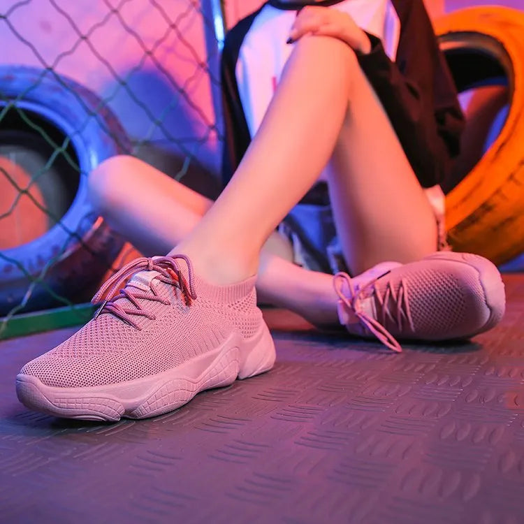 White women's thick-soled casual trainers with woven upper and front strap closure