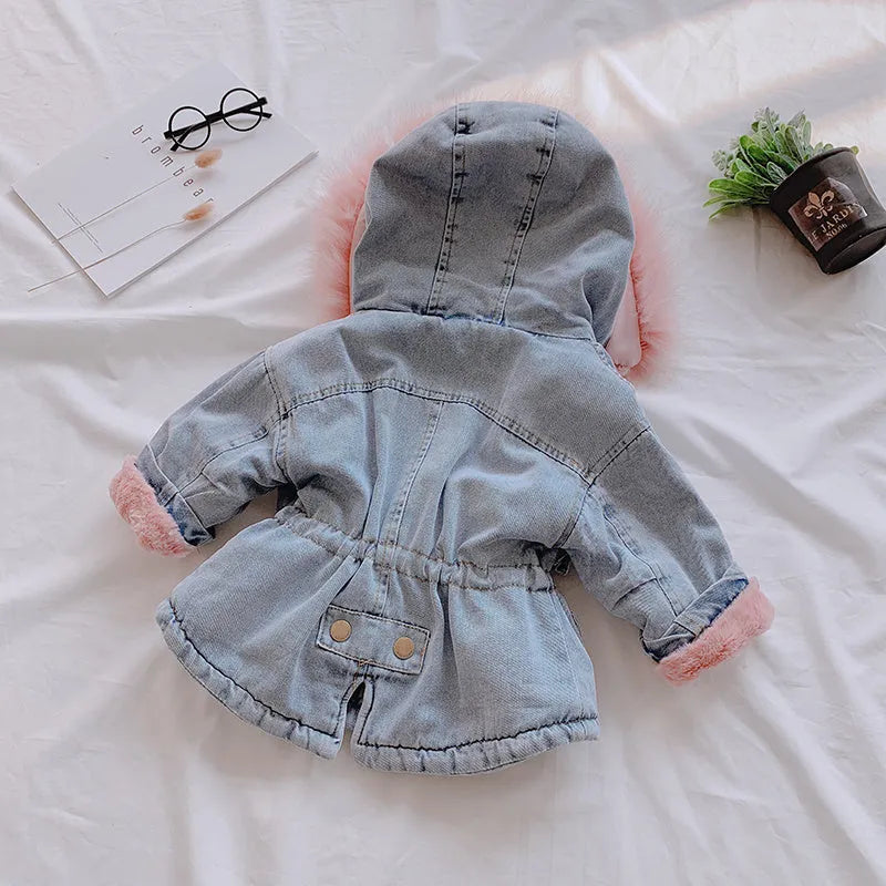 Blue denim coat for girls with a hood and plush fleece lining, shown on a hanger.
