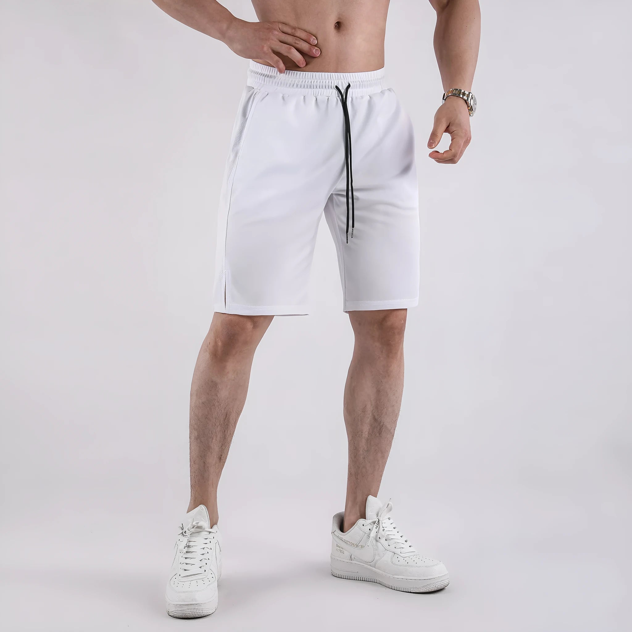 Men's black quick-drying mesh sports shorts with a loose fit and elasticated waist.