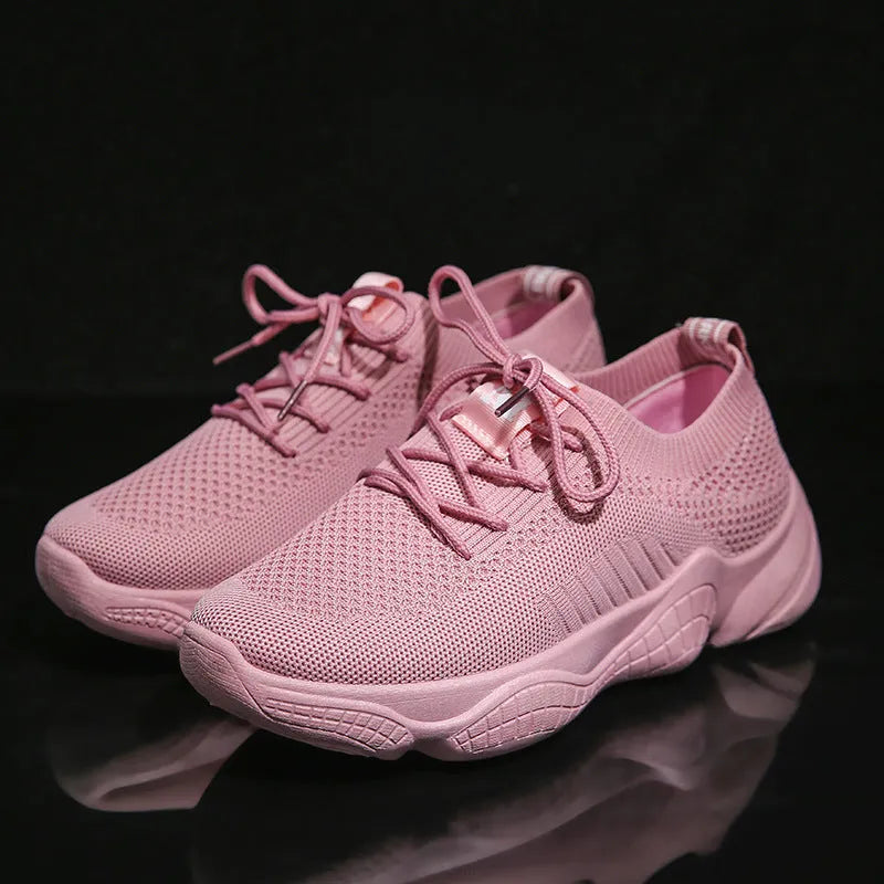 White women's thick-soled casual trainers with woven upper and front strap closure