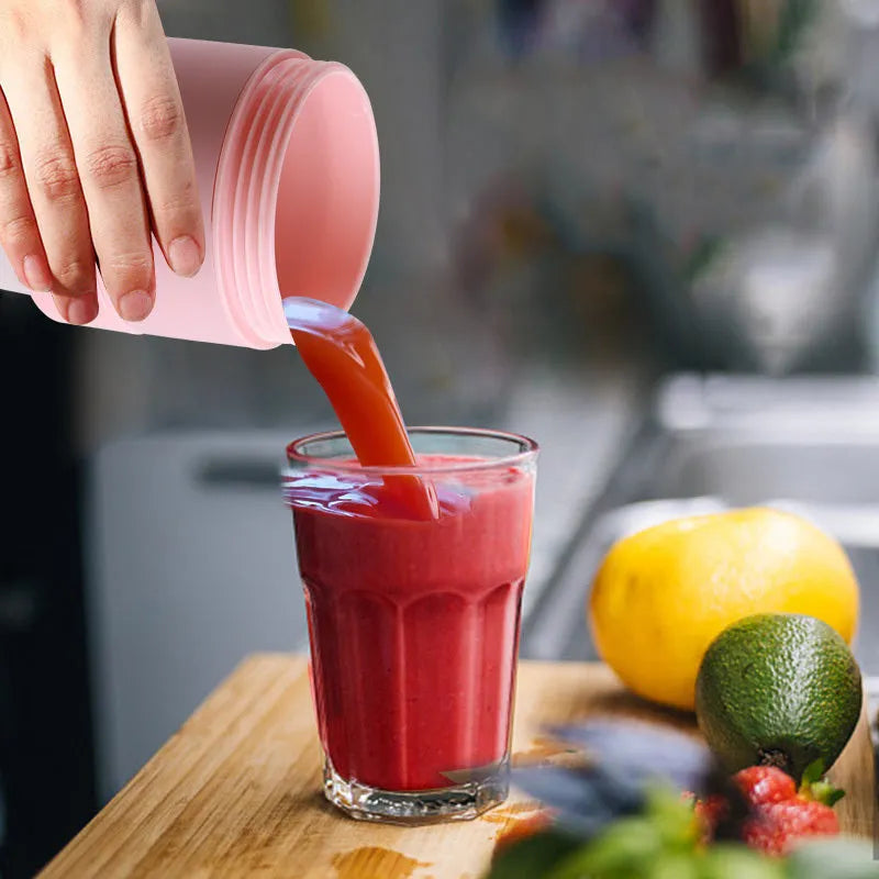 Blue portable blender with six stainless steel blades, USB charging port, and 450ml silicone cup