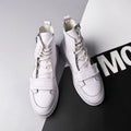 Men's black high-top ankle boot made of PU leather microfiber, shown on a white background.