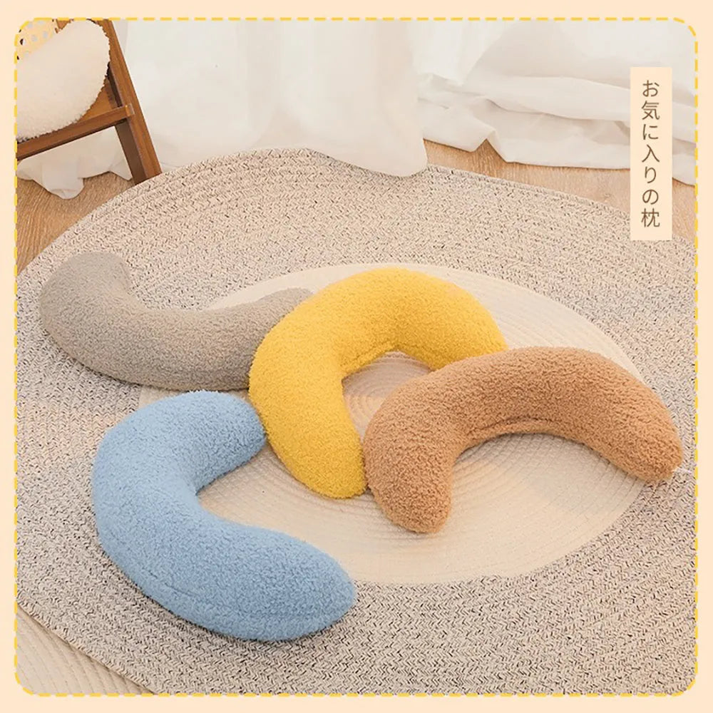 U-shaped blue cat pillow with adjustable neck collar on sofa