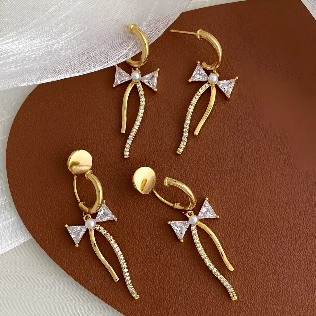Asymmetric micro-set zirconia C-shaped light luxury earrings in copper, ear clip style on a woman