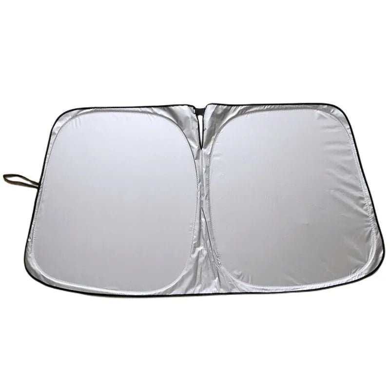 Titanium silver aluminium foil car sunshade folded, showing its reflective surface.