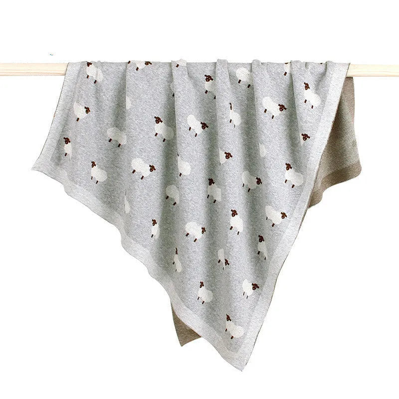 Pink and grey 100% cotton baby sheepskin blanket measuring 100x80cm for cots and prams.