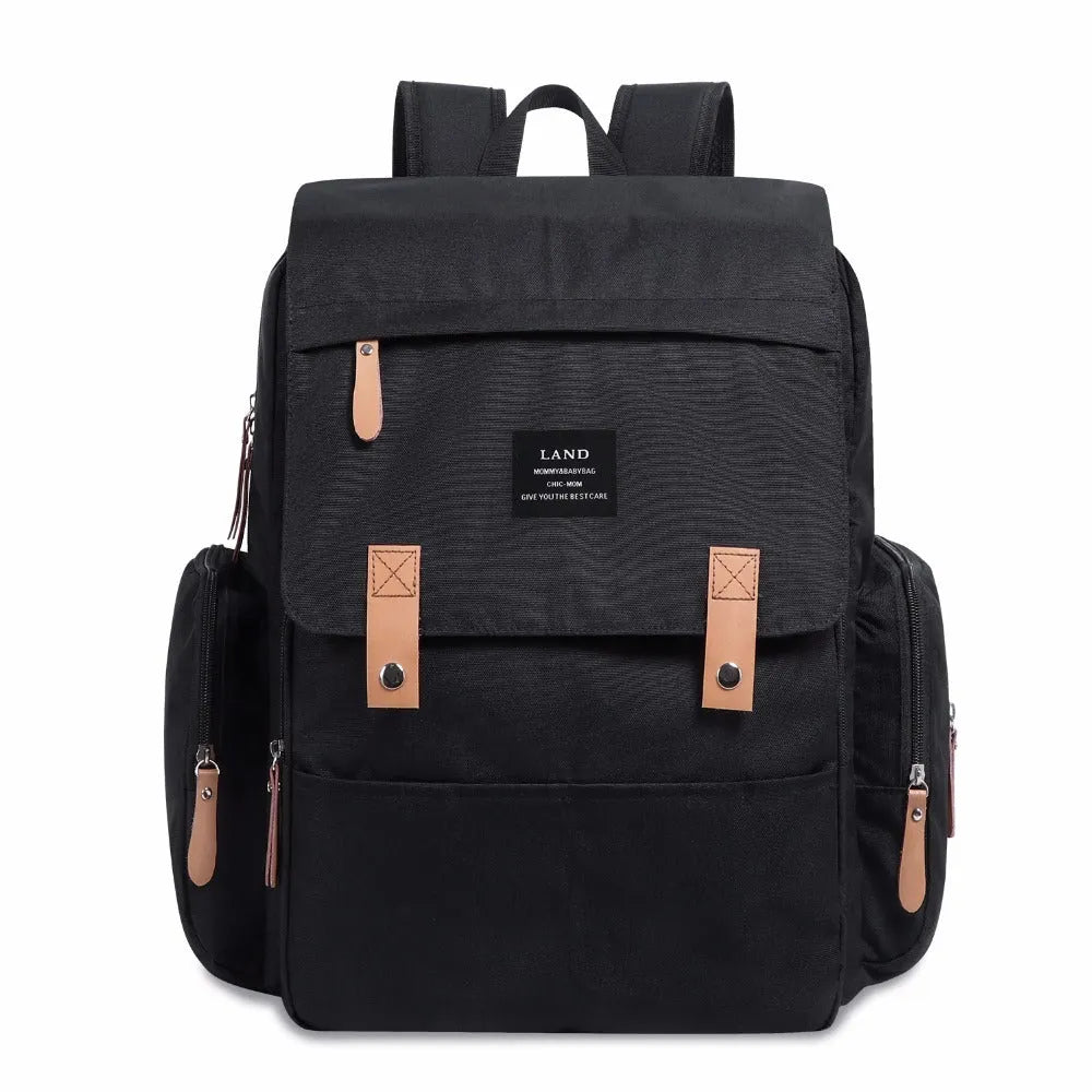LAND Mommy Diaper Backpack in Oxford cloth with integrated changing mat, showing backpack straps and main compartment.