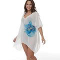 White plus size loose beach cover-up blouse on a hanger