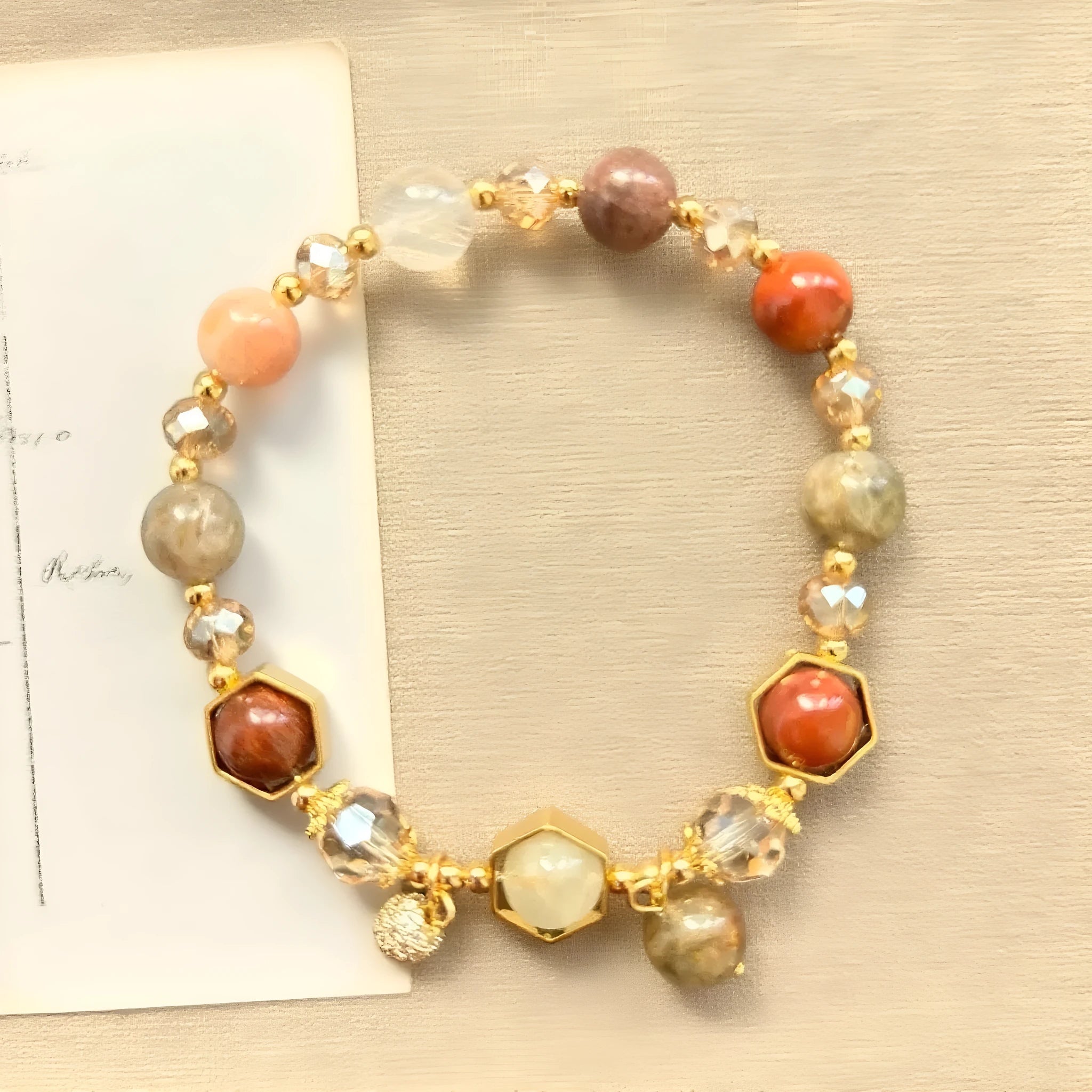 Gold citrine crystal bracelet with hand-woven construction showing auspicious Chinese symbols
