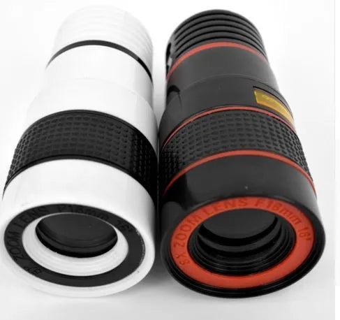 12X magnification black phone telescope lens with universal mounting clip and cleaning cloth on a table.
