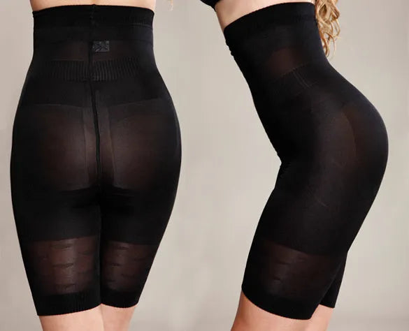 Women's black seamless high-waist shapewear shorts laid flat showing tummy control panel.