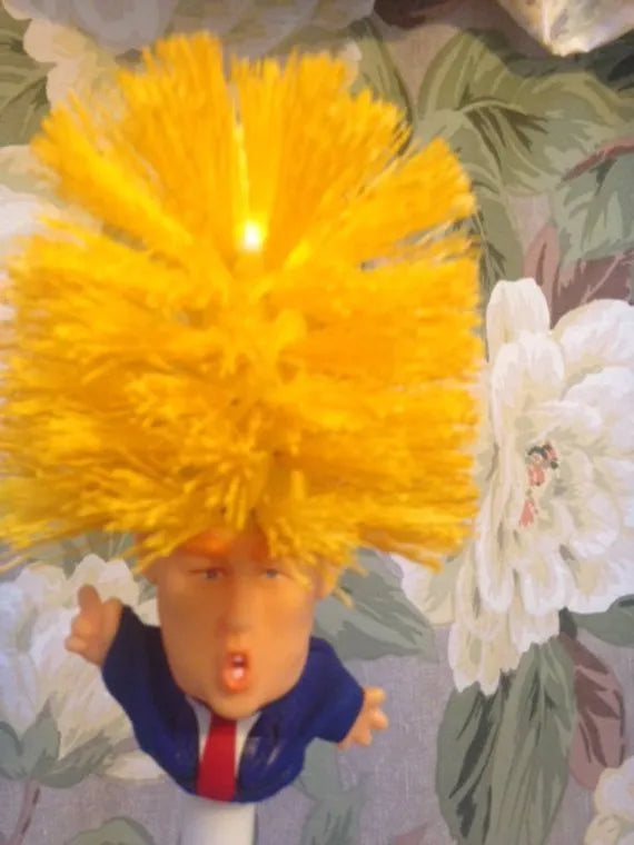 Yellow plastic Donald Trump novelty toilet brush with hanging handle, 40cm long