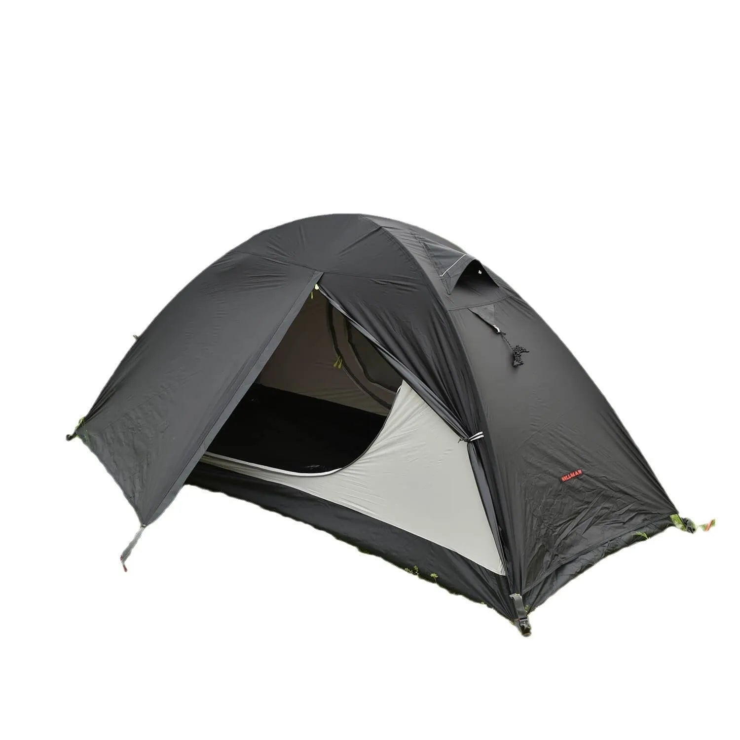 Red single person backpacking tent with aluminium poles pitched outdoors.