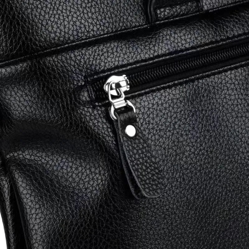 Black PU leather men's messenger bag with shoulder strap showing splicing design details