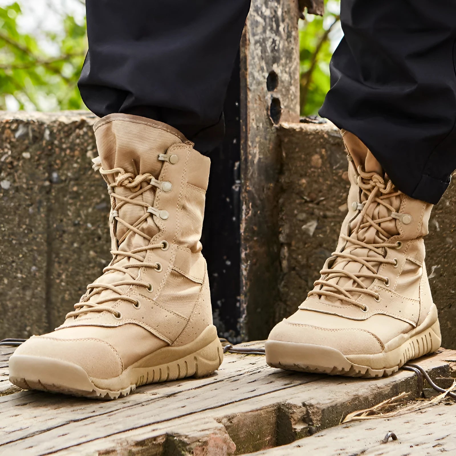 Yulong summer tactical desert combat boots in black or sand colour on an outdoor rocky terrain.