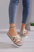 Creamy-white women's platform sandals with a cloth upper, beach bow detail, and slip-on sleeve design.