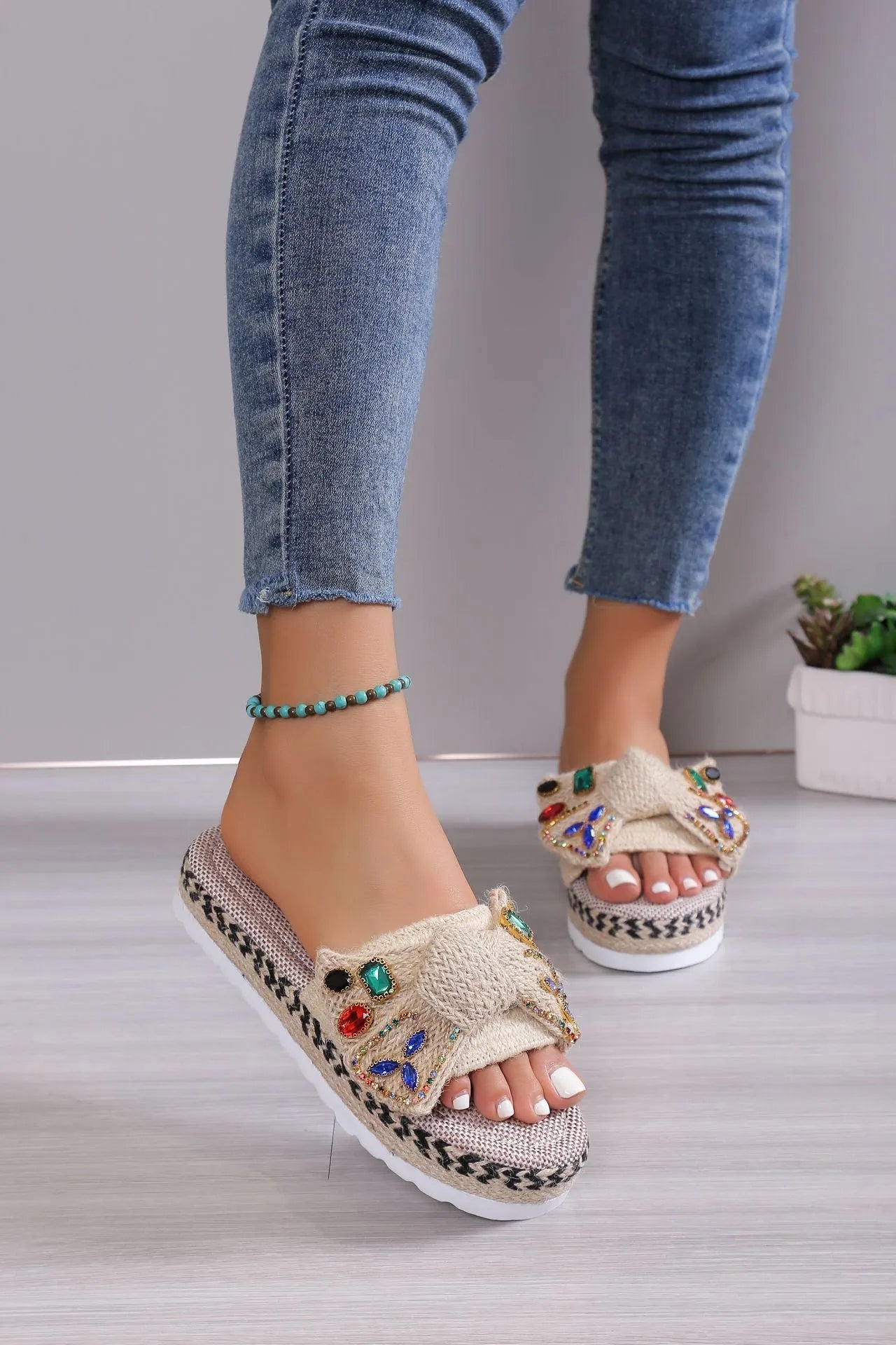 Creamy-white women's platform sandals with a cloth upper, beach bow detail, and slip-on sleeve design.
