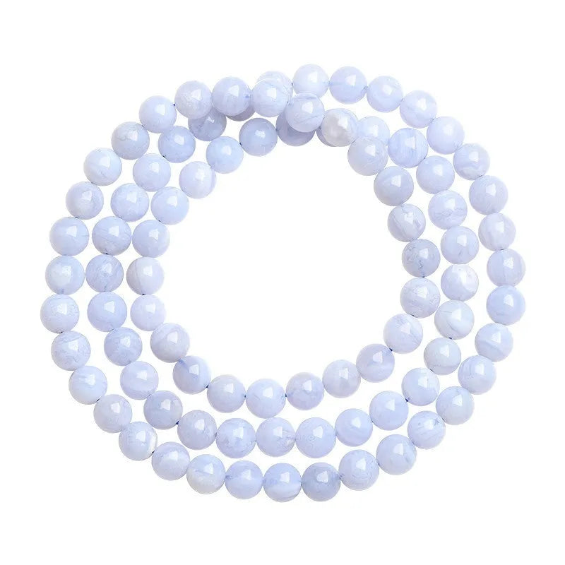 Blue agate beaded bracelet with striped patterning on 6-6.8mm beads in three circular strands