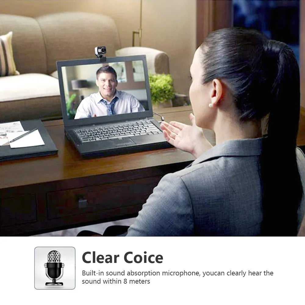 Blue mini USB webcam with a 360-degree rotating head on a desk next to a laptop.