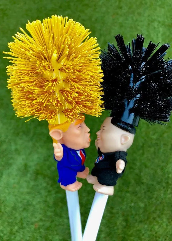 Yellow plastic Donald Trump novelty toilet brush with hanging handle, 40cm long